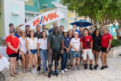 RE/MAX CAYMAN ISLANDS DONATES 10 SCOOTERS & 10 HELMETS TO BLACK PEARL SKATEPARK