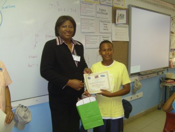 Director Norma McField & a student participant in an Earth Day PSA writing competition