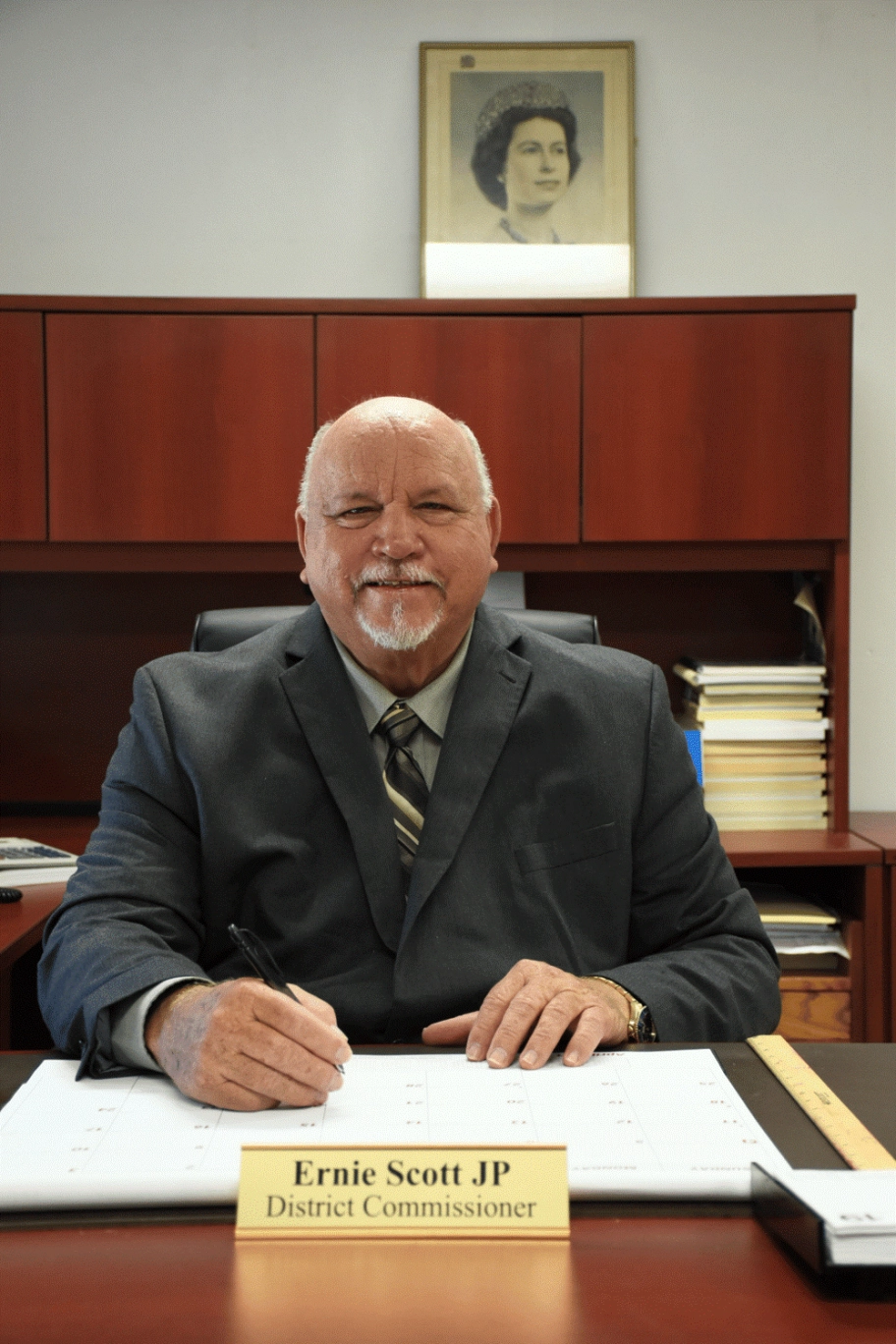 Passing of Former District Commissioner Mr. Ernie Scott JP